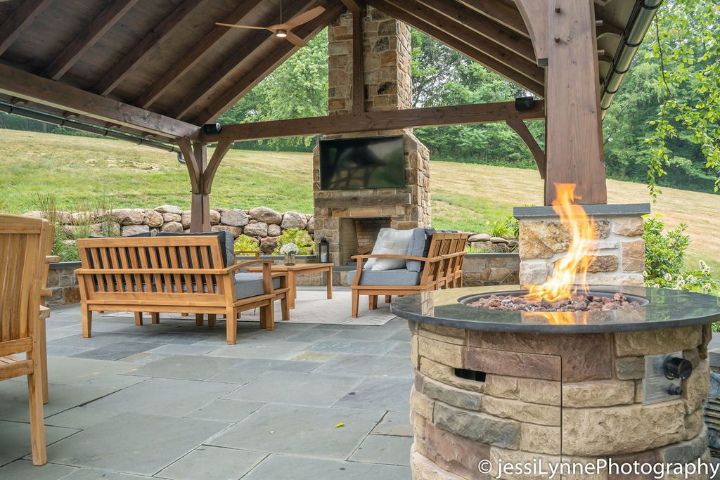 stone fireplace in an outdoor seating area