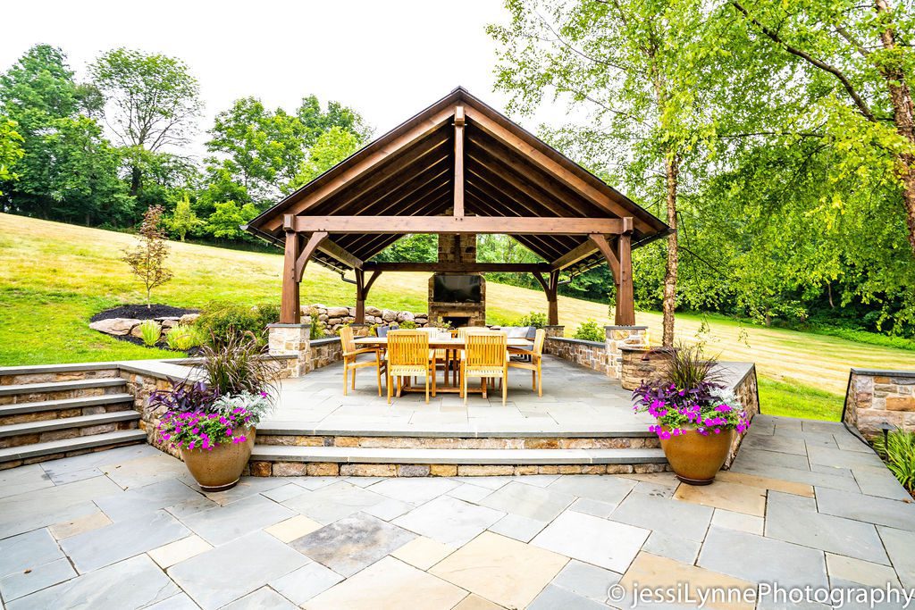 raised stone deck with fireplace