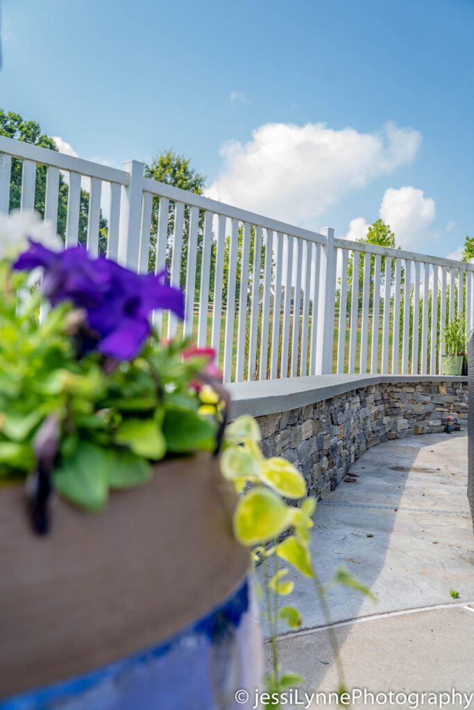 vinyl deck fence with stone wall