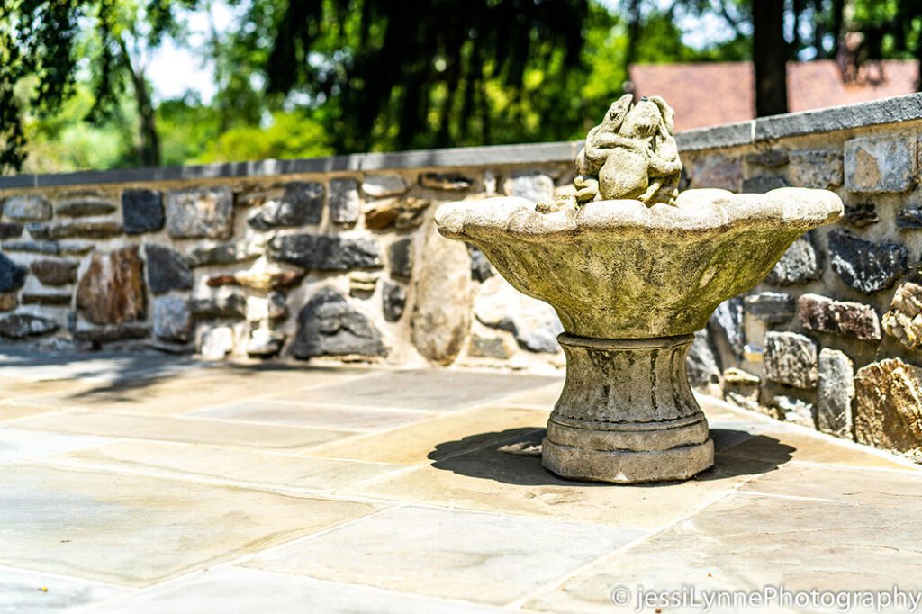fountain by a stone wall