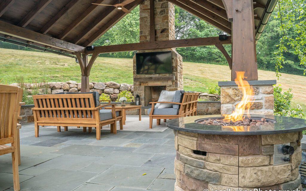 raised stone deck with fireplace